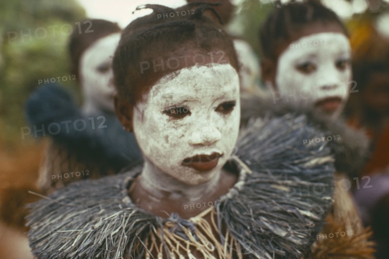 SIERRA LEONE, Initiation Ceremony, Portrait of girl initiate with white painted face.