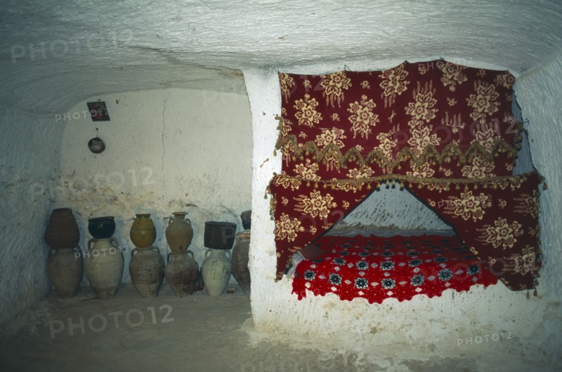TUNISIA, Zaraoua, "Berber home, interior room cut from rock"
