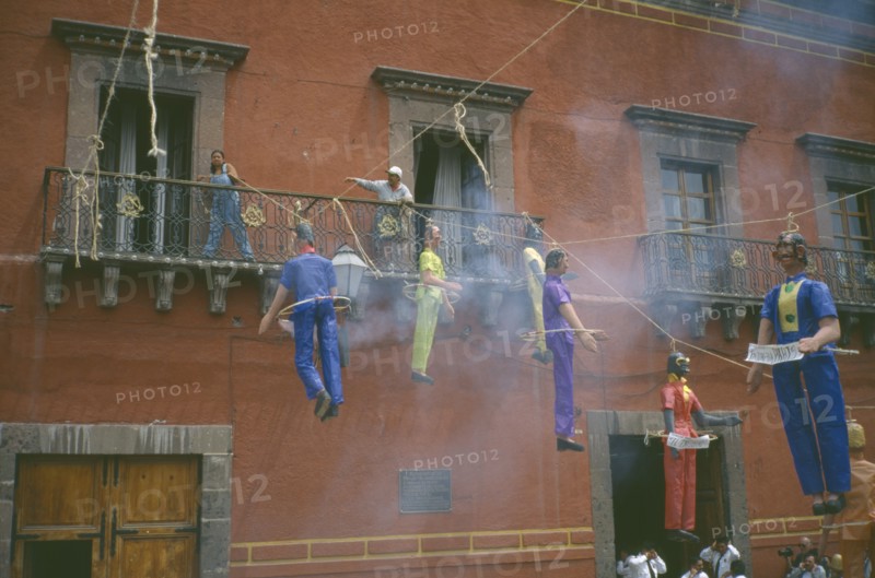 MEXICO, Guanajuato, San Miguel de Allende, Exploding papier-mache Judas Iscariot figures in the Plaza Principal during the Easter Sunday celebrations at the end of  Holy Week.