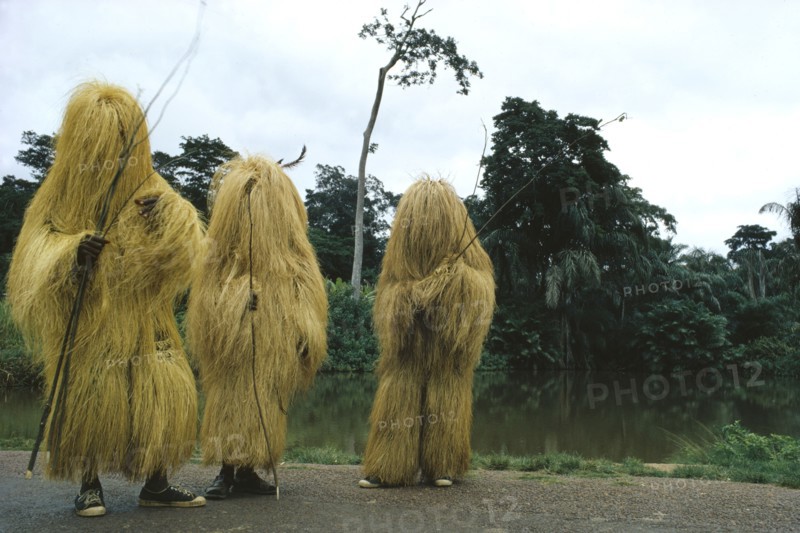 NIGERIA, Traditional Dress, Yoruba Egungun masqueraders at the source of the River Oshon