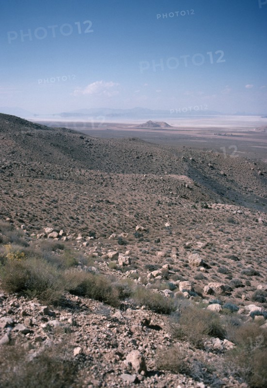 IRAN, Fars Province, East Of Shiraz, View from hills down towards a salt lake in the valley below