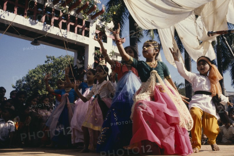 INDIA, Goa, Margao, Children dressed as adults performing dance during carnival.
