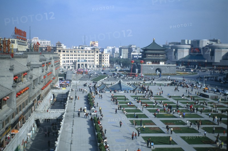 CHINA, Shaanxi, Xian. View from Drum Tower across busy square towards Bell Tower.
