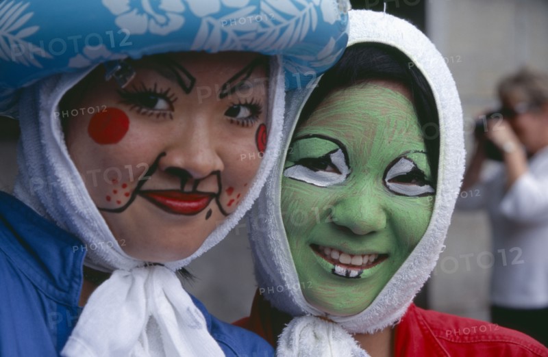 JAPAN, Honshu, Tokyo, Harajuku District. Portrait of two smiling girls wearing face paint