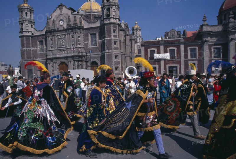 MEXICO, Mexico City, Celebrations for Our Lady of Guadaloupe outside the Basilica with dancers in costume.