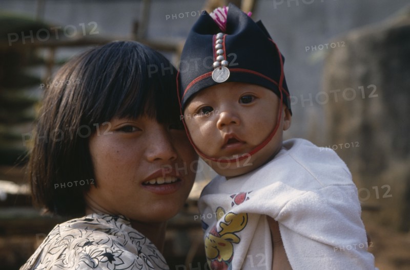 THAILAND, North, Portrait of two Akha tribe children near Chiang Rai.