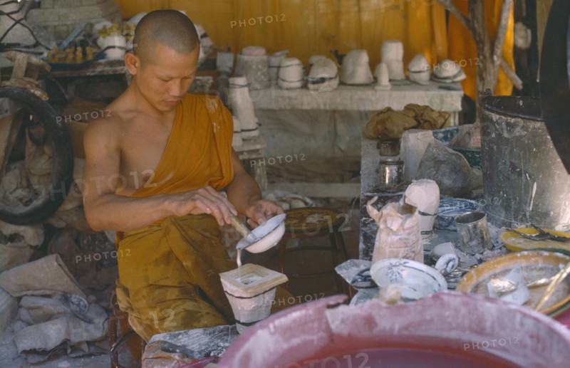 THAILAND, Religion, People, Monk making Buddhist casts.