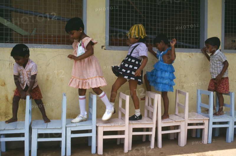 SRI LANKA, Colombo, Children learing to count through game playing.