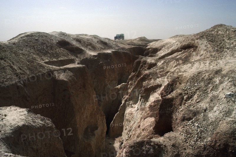 BURKINA FASO, Sahel, Landrover on ridge of land above old gold workings.