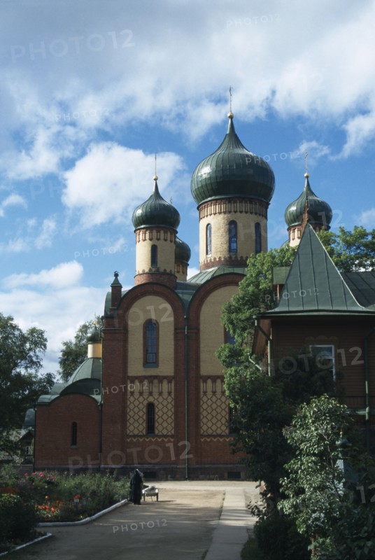 ESTONIA, East, Buildings, Puhtitsa Russian Orthodox Convent.  Exterior facade with onion dome rooftops and gardens.