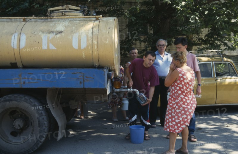UKRAINE, Odessa, Milk tanker delivering milk to people living in the city suburbs.