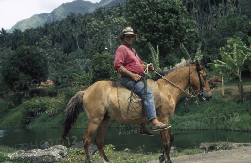 PACIFIC ISLANDS, Polynesia, French Polynesia, "Marquesas. Taipivai, Nuku Hiva.  Horserider."
