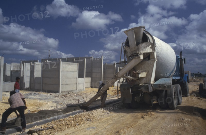 WEST INDIES, Dominican Republic, Construction, Laying concrete pavement on building site.