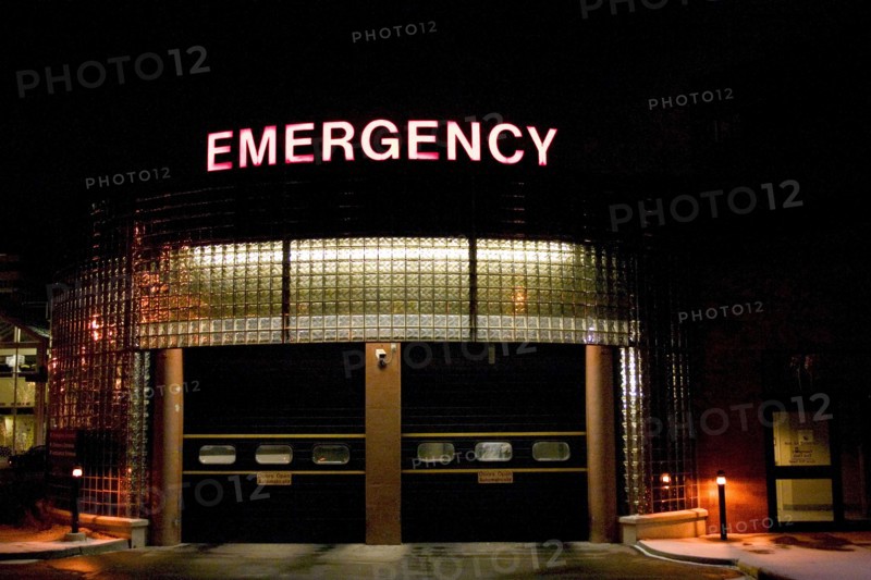 USA, Minnesota, St Paul, Emergency vehicle entrance at United Hospital illuminated at night