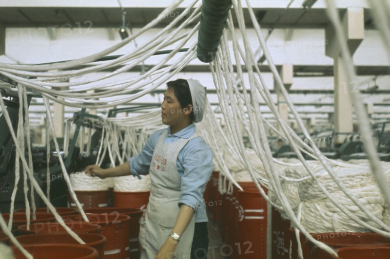 CHINA, Industry, Woman working in cotton factory.