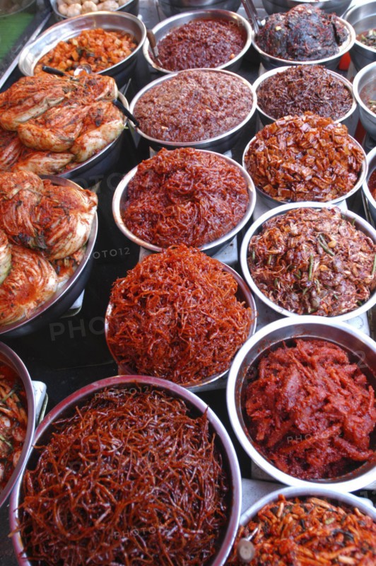 KOREA, Seoul, Namdaemun Market. Varieties of kimchi displayed on a stall