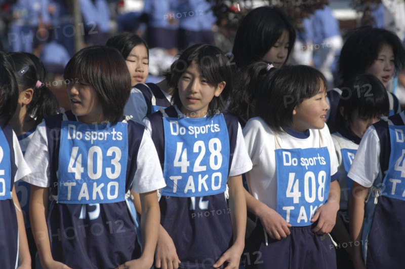 JAPAN, Chiba, Tako, 11-12 year old girls await the start of 2 kilometer race which is part of the towns fitness festival