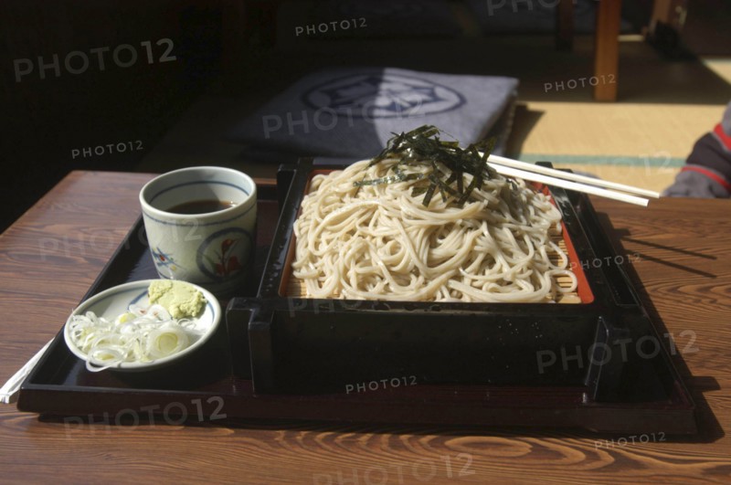 JAPAN, Chiba, Tako, """zaru soba"" cold buckwheat noodles with chilled ""tsuyu"" ( soy sauce-based dipping soup) and small plate contains chopped ""negi"" (Japanese leek) and wasabe"