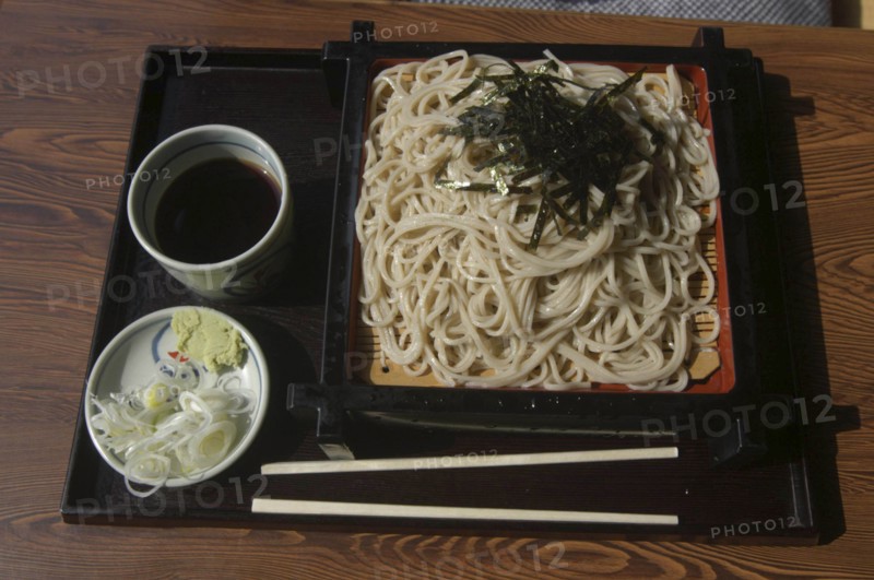 JAPAN, Chiba, Tako, """zaru soba"" cold buckwheat  noodles with ""tsuyu"" soy sauce-based dipping soup, small plate contains chopped ""negi"" (Japanese leeks) and wasabe paste"