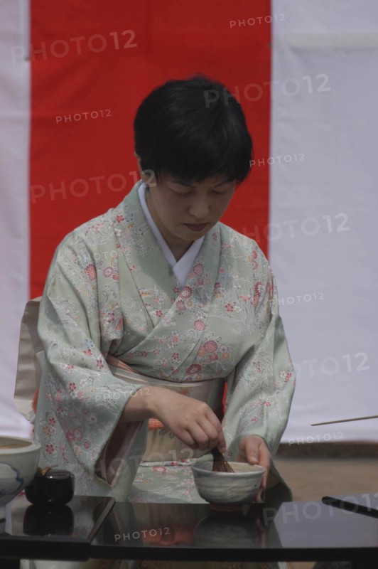 JAPAN, Chiba, Yokaichiba, "Licensed tea master Chiharu Koshikawa prepares green tea ""macha"" at a tea ceremony, wearing kimono MR"