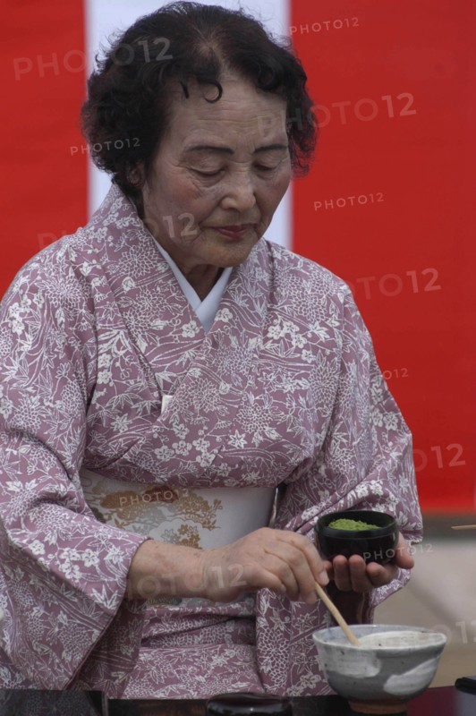 JAPAN, Chiba, Yokaichiba, "Licensed tea master Shikako Namba prepares green tea ""macha"" at a tea ceremony"