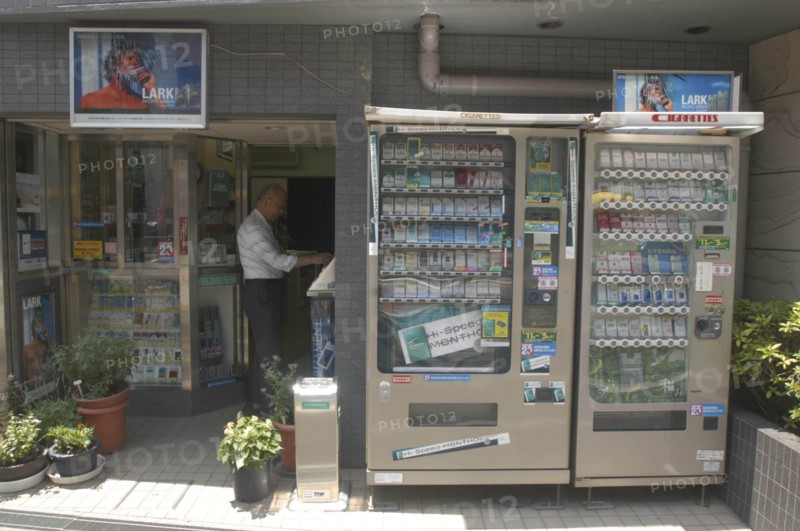 JAPAN, Honshu, Tokyo, Nezu. Cigarette shop with cigarette vending machines