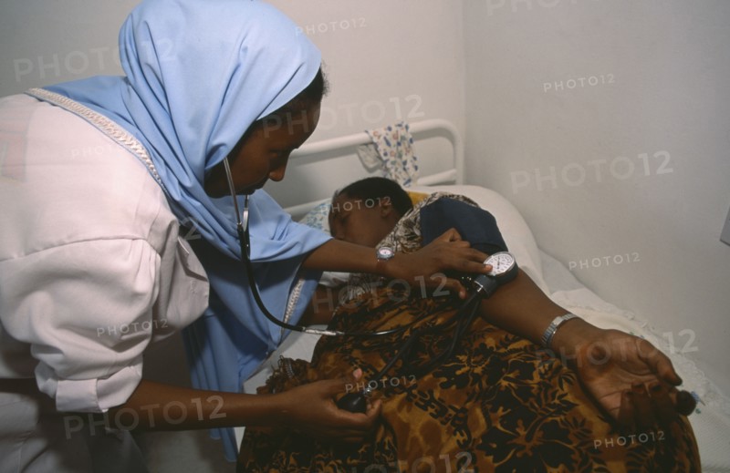 SOMALILAND, Hargeisa, Nurse taking blood pressure of patient in Edna Adan maternity hospital.