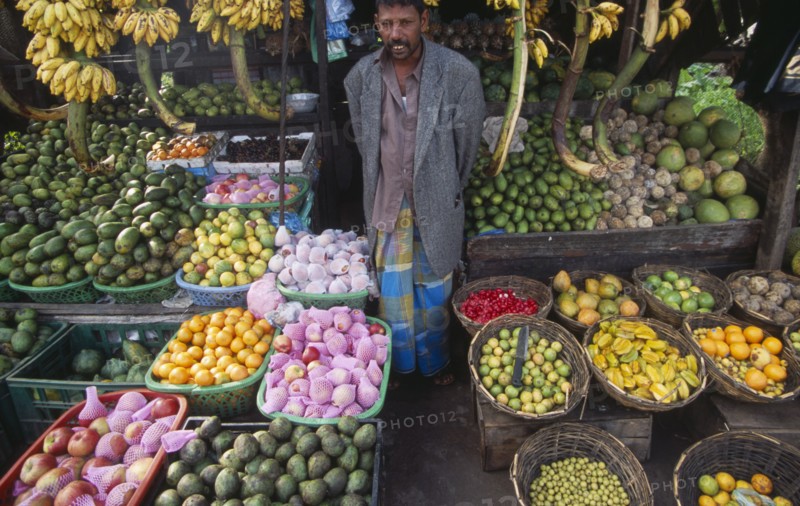 SRI LANKA, Haputale, Fruit stall and vendor.