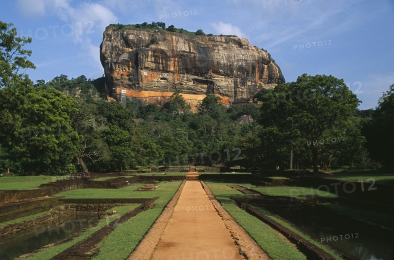 SRI LANKA, Sigiriya, View along path toward huge monolithic rock site of fifth century citadel. Also called Lion Rock.
