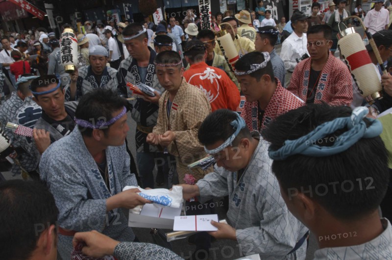 JAPAN, Chiba, Narita, "Gion Matsuri. Men in Edo-era costumes, each specific to their neighborhood, exchange gifts before starting that day's festivities"