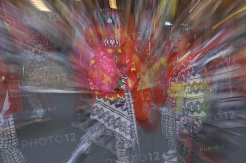 JAPAN, Chiba, Narita , "8-12 year old girls called ""tekomae"" in traditional Edo-era costumes, wait to proceed their neighborhood Dashi or wagon, pulled through the streets during Gion matsuri. Radial blur."