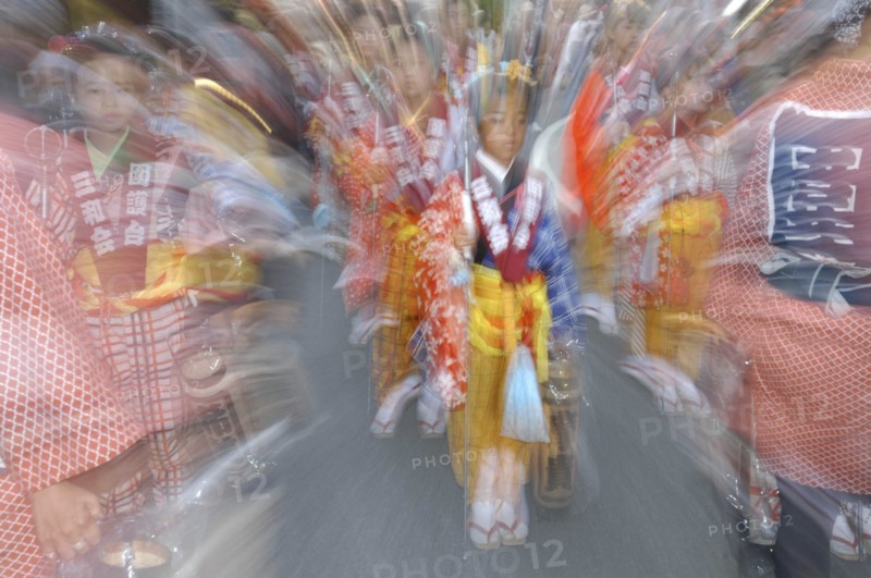 JAPAN, Chiba, Narita, "Maki Tsuchiya, 9 years old, leads the ""tekomae"", young girls proceeding the wagon pulled during Gion Matsuri wearing traditional Edo-era costume Radial Blur."