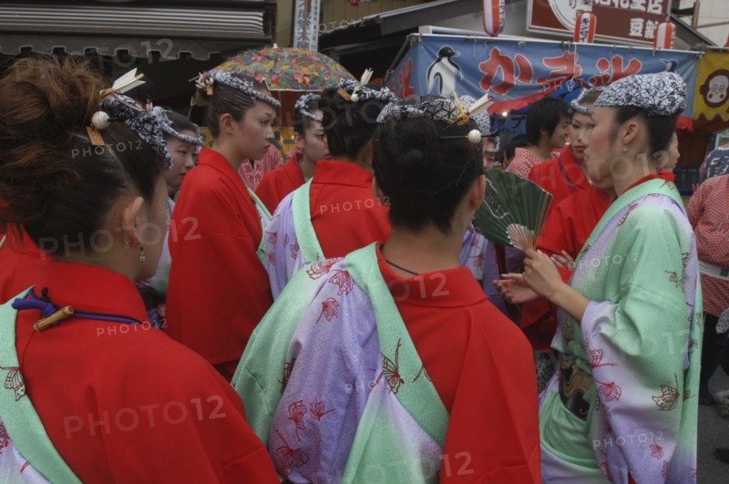 JAPAN, Chiba, Narita, Women aged 20-30 years old in traditional Edo-era costumes get instructions before pulling their neighborhood dashi or wagon during the Gion Matsuri