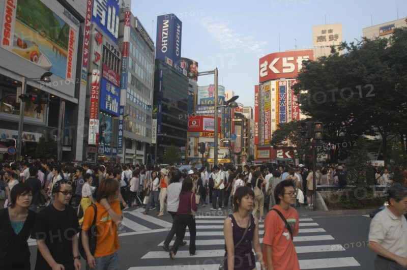 JAPAN, Honshu, Tokyo, Crowds on pedestrian crossing on Shinjuku-dori avenue on Saturday evening directly in front of Shinjuku station