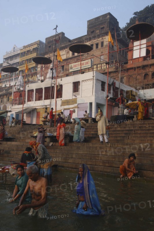 INDIA, Uttar Pradesh, Varanasi , Early morning bathers in the Ganges River by Dashaswamedh Ghat