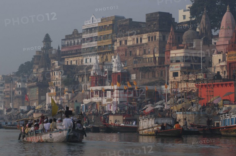INDIA, Uttar Pradesh, Varanasi , Dashaswamedh Ghat on the Ganges River looking south with boats and bathers
