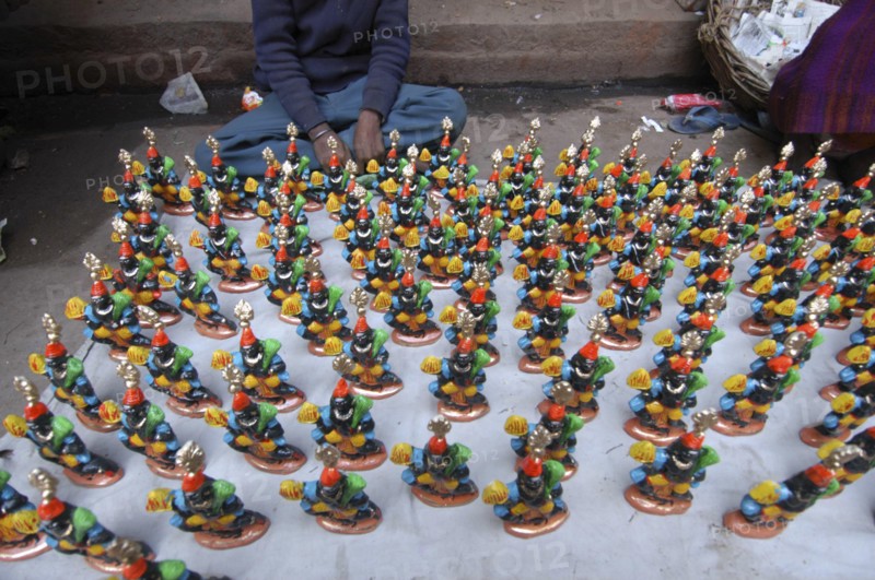 INDIA, Uttar Pradesh, Varanasi, Figurines of Kala Bhairava for sale outside Kala Bhairava Temple