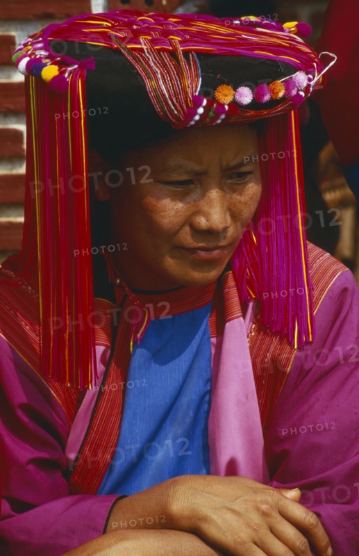 THAILAND, Chiang Rai, Doi Lan. Portrait of a Lisu woman in traditional Lisu attire and hat