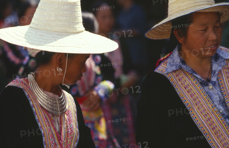 THAILAND, Chiang Mai, Two Hmong women in traditional attire