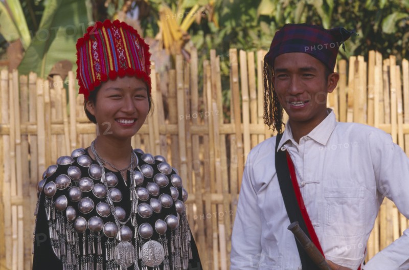 THAILAND, Chinag Mai Province, Muang Nga, Young Jinghpaw man and woman in traditional attire
