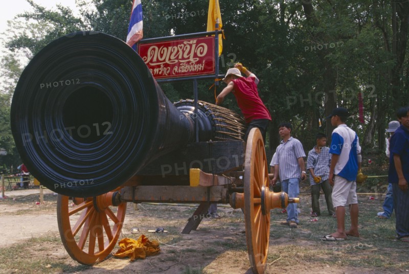 THAILAND, Chiang Mai, Cannon drum competition with drummer beating drum