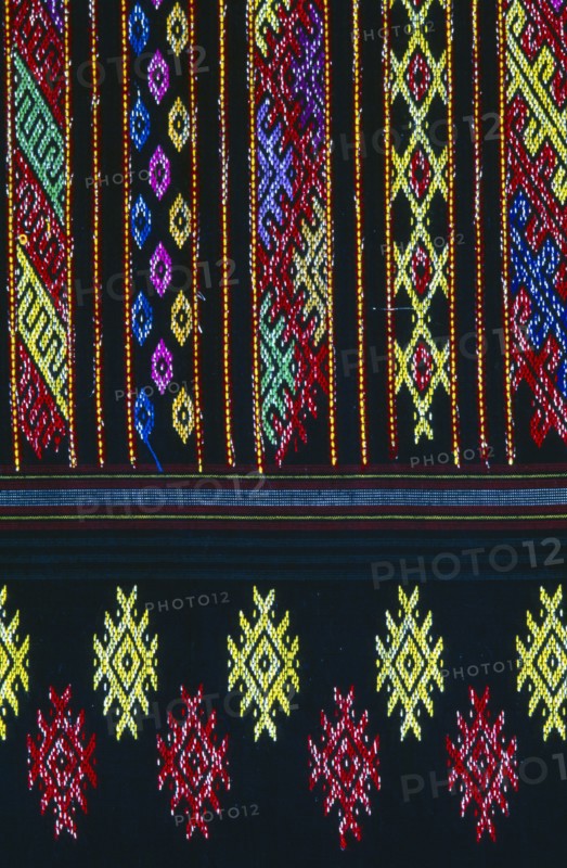 MYANMAR, Kachin State, Myitkyina, Close up detail of a Lacid womans sarong which is traditional Kachin attire