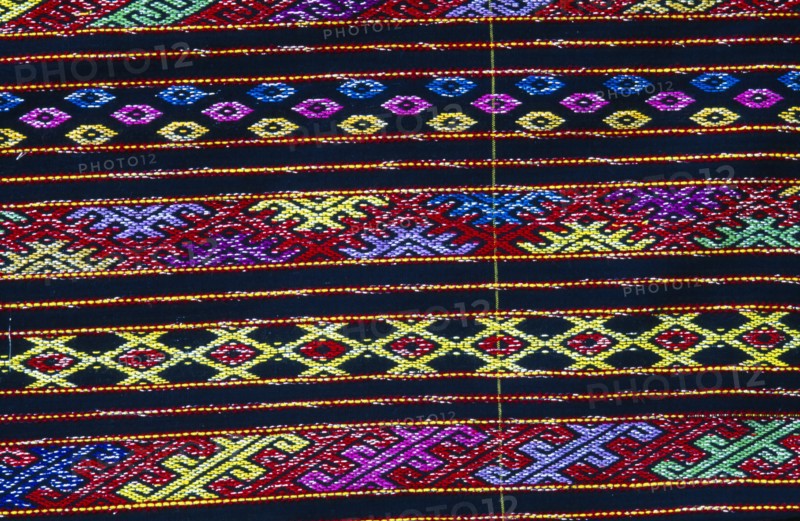 MYANMAR, Kachin State, Myitkyina, Close up detail of a Lacid womans sarong which is traditional Kachin attire