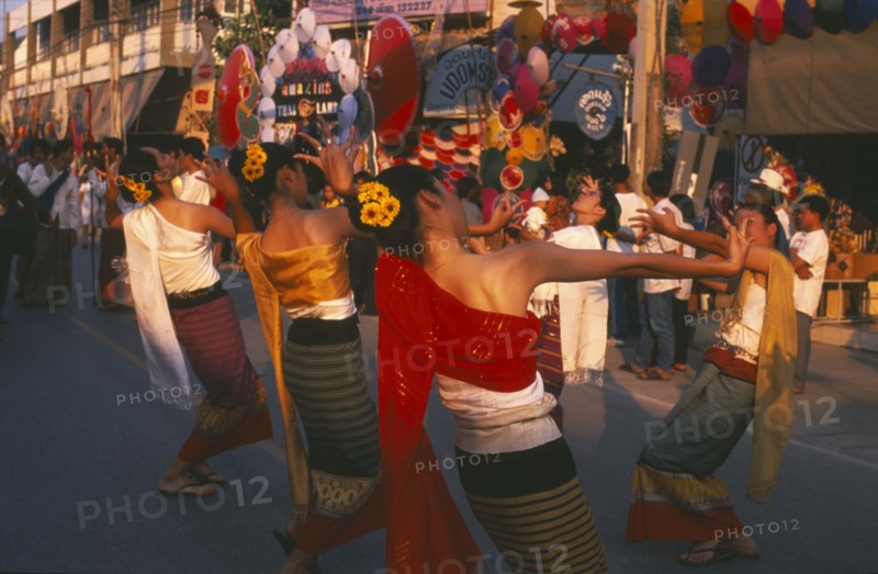 THAILAND, Chiang Mai, Baw Sang, Dancers in traditional northern Thai attire performing traditional Thai dance at the Umbrella Festival