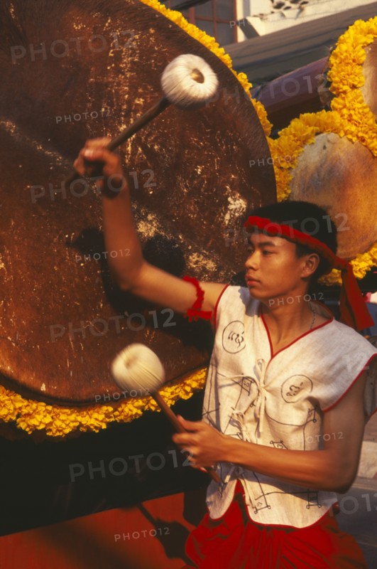 THAILAND, Chiang Mai, Traditional Thai drummer with large drum in the Flower Festival parade