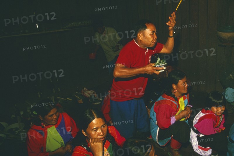 THAILAND, Chiang Rai Province, Doi Lan, New Year. Shaman performing ceremony to cure villagers afflictions