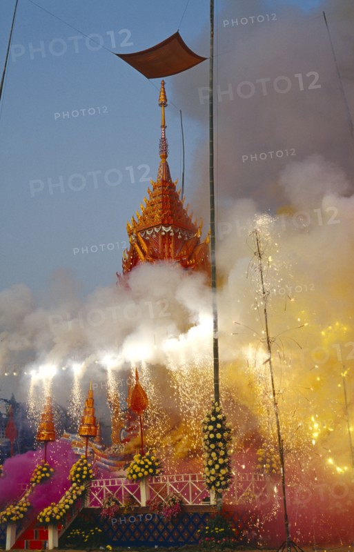 THAILAND, Chiang Mai, Revered monks funeral with smoking mythical elephant swan funeral pyre on the cremation grounds