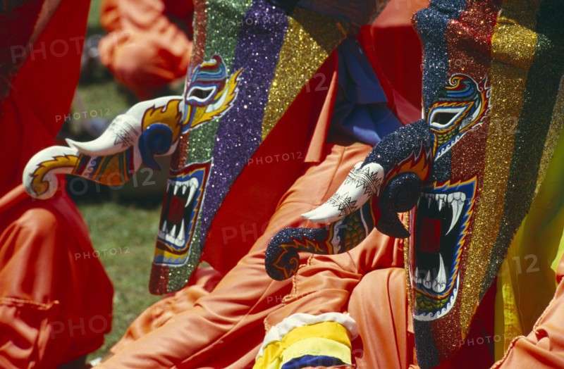 THAILAND, Loei Province, Dan Sai, Phi Ta Khon or Spirit Festival. People wearing brightly coloured spirit cotumes
