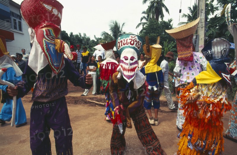 THAILAND, Loei Province, Dan Sai, Phi Ta Khon or Spirit Festival. People in spirit costumes during parade