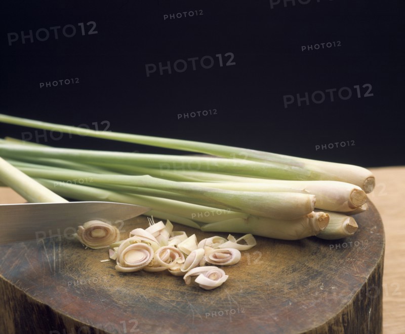 THAILAND, General, Lemon grass with sliced ends on a wood block cutting board